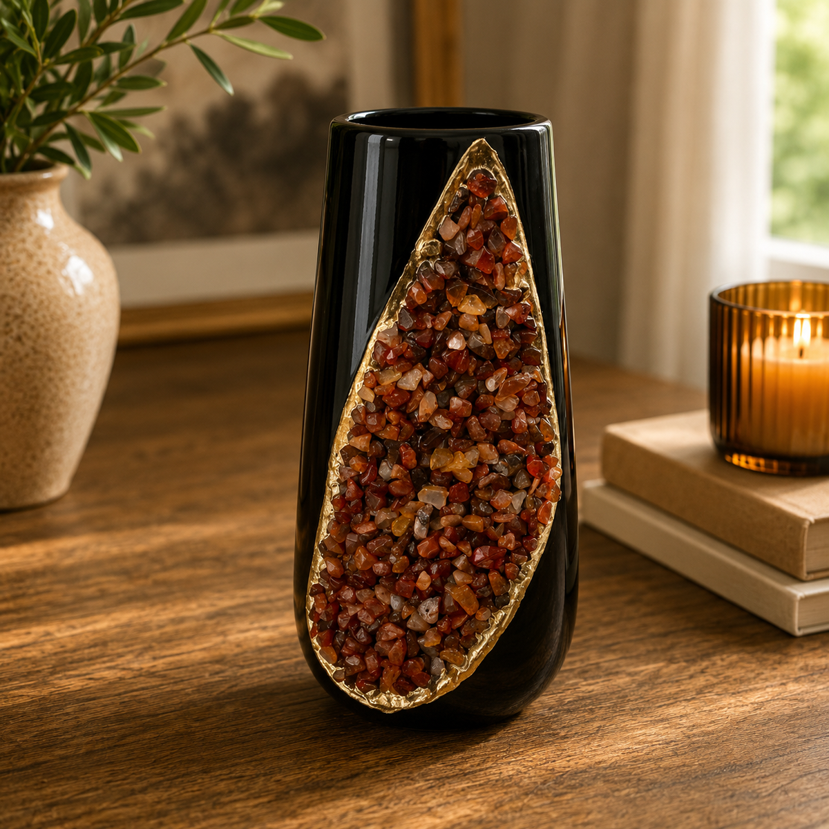 Red agate glowing in the teardrop, black vase on wood beside a lit candle
