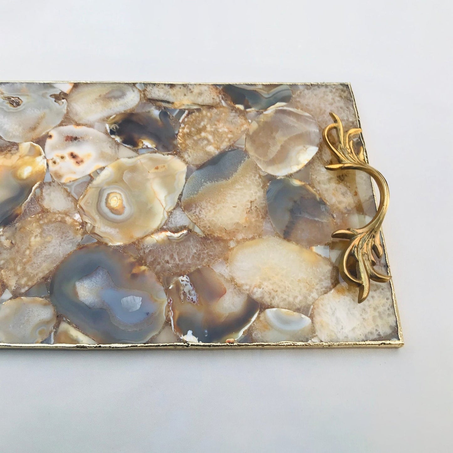 Golden brown agate rectangular serving tray — botanical leaf handles, detail view