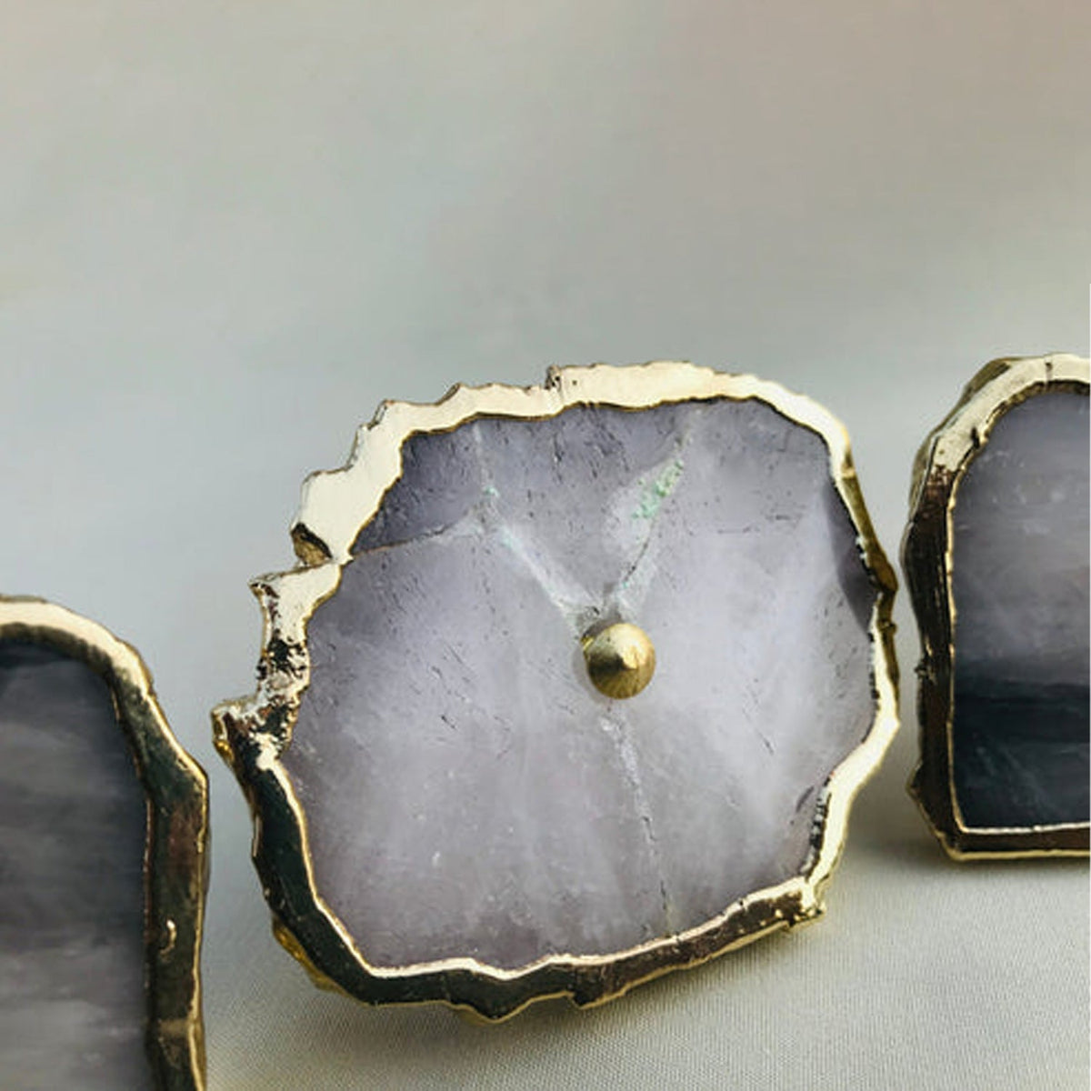 Three slices, pale lilac grey stone and thin uneven gold borders