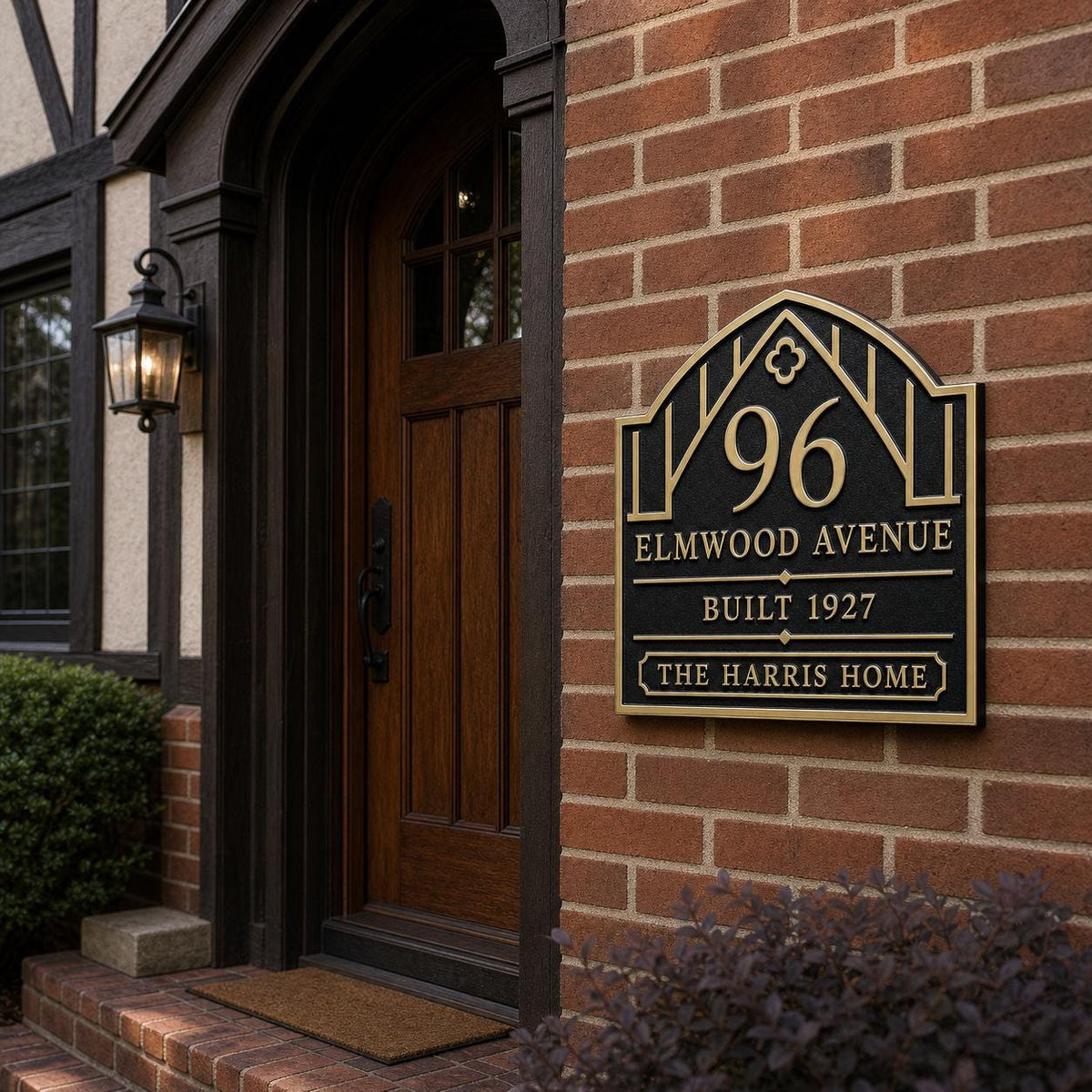 Craftsman Arch plaque, pictured on a brick entrance wall
