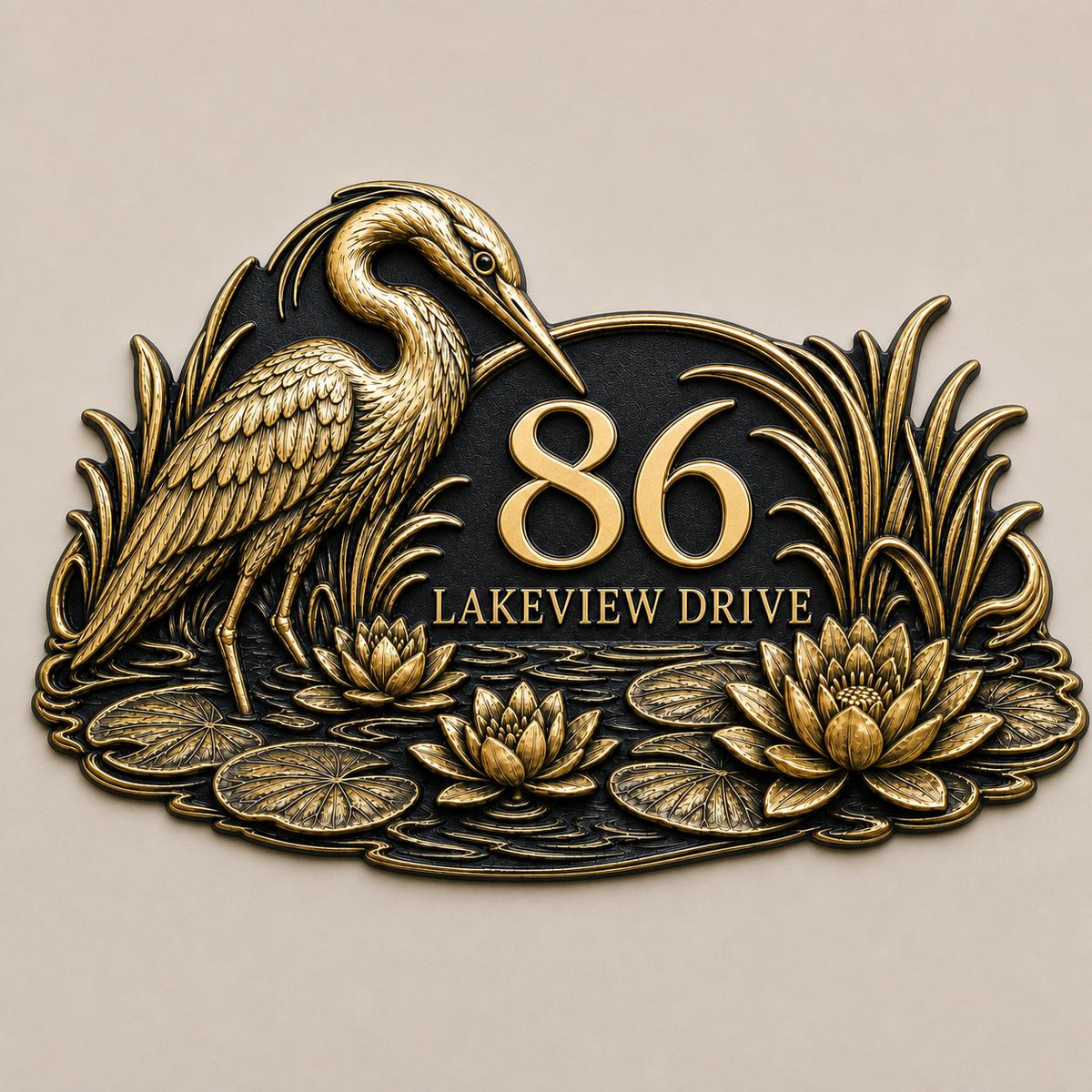 Heron and Waterlilies plaque in antique brass, front view showing the raised design and lettering