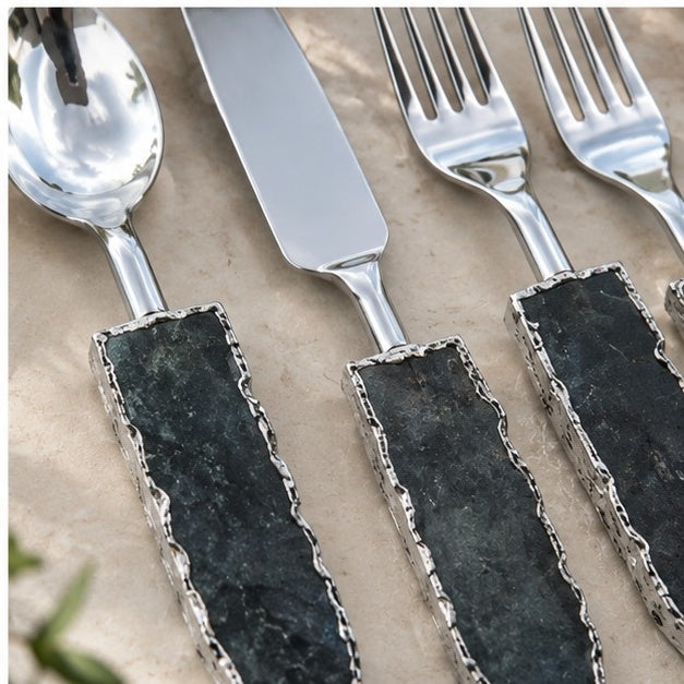 Lepidolite knife and forks close up, stone handles filling the frame