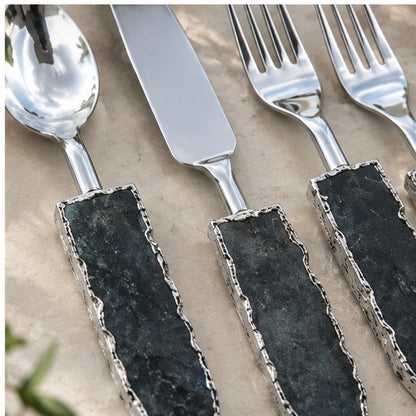 Lepidolite knife and forks close up, stone handles filling the frame