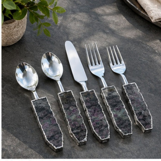 Lepidolite cutlery set of five with mottled grey green stone handles, on a dark slate board