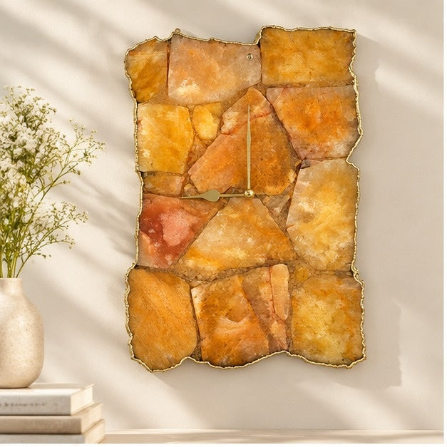 Large golden brown agate wall clock, amber mosaic with a gold organic edge, above a console