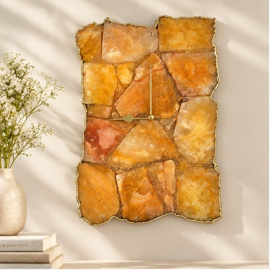 Large golden brown agate wall clock, amber mosaic with a gold organic edge, above a console