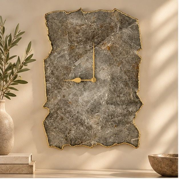 Large grey agate wall clock, taupe stone slab with a gold organic edge, above a console