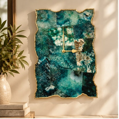 Composite green agate wall clock on a warm wall beside a plant