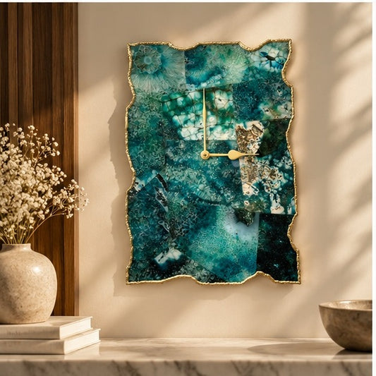 Large composite green agate wall clock, teal mosaic with a gold organic edge, above a console