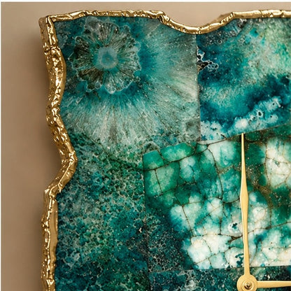 Close view of the teal agate mosaic, the gold organic edge and the gold hand