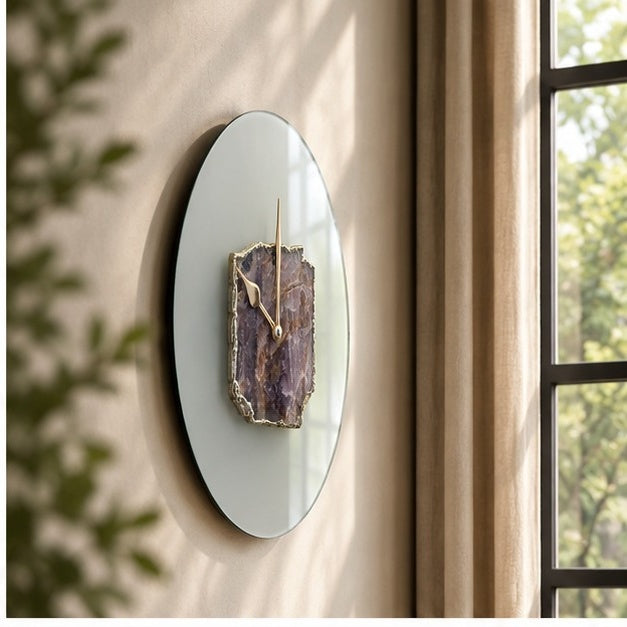 Frosted glass amethyst wall clock seen at an angle against a window