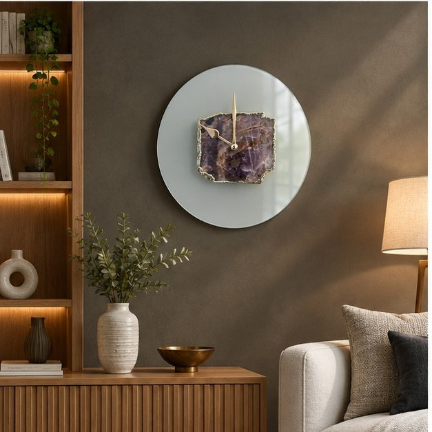 Frosted glass amethyst wall clock in a living room beside a wood sideboard