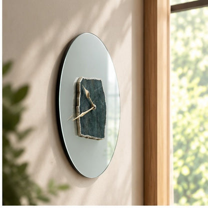 Frosted glass green aventurine wall clock seen at an angle against a window