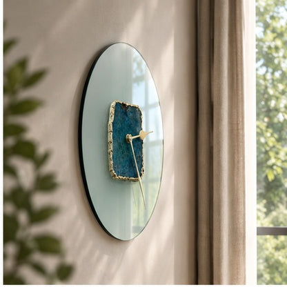 Glass agate wall clock seen at an angle against a window, showing the depth of the glass