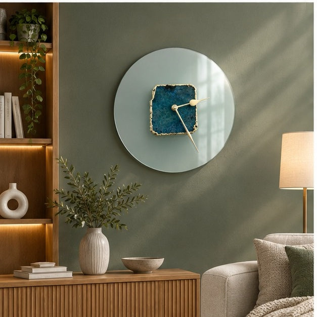 Glass agate wall clock in a living room above a wood sideboard