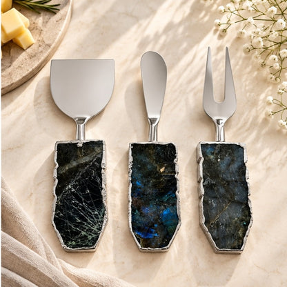 Labradorite cheese knife set in the silver finish, stone handles on cream linen