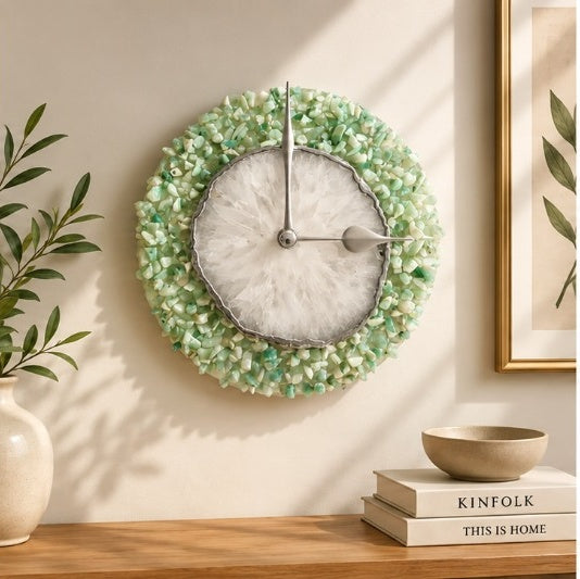Light green crystal agate wall clock on a warm wall with greenery