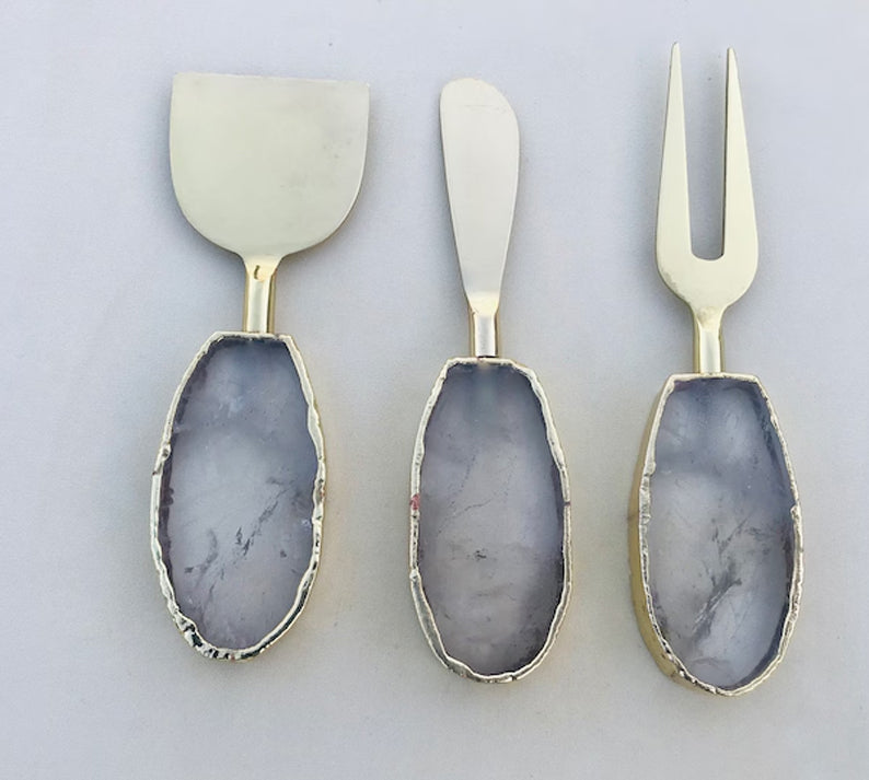 Clear Quartz Oval Cheese Board Set – top view, clear stone handles, silver finish