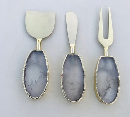Clear Quartz Oval Cheese Board Set – top view, clear stone handles, silver finish