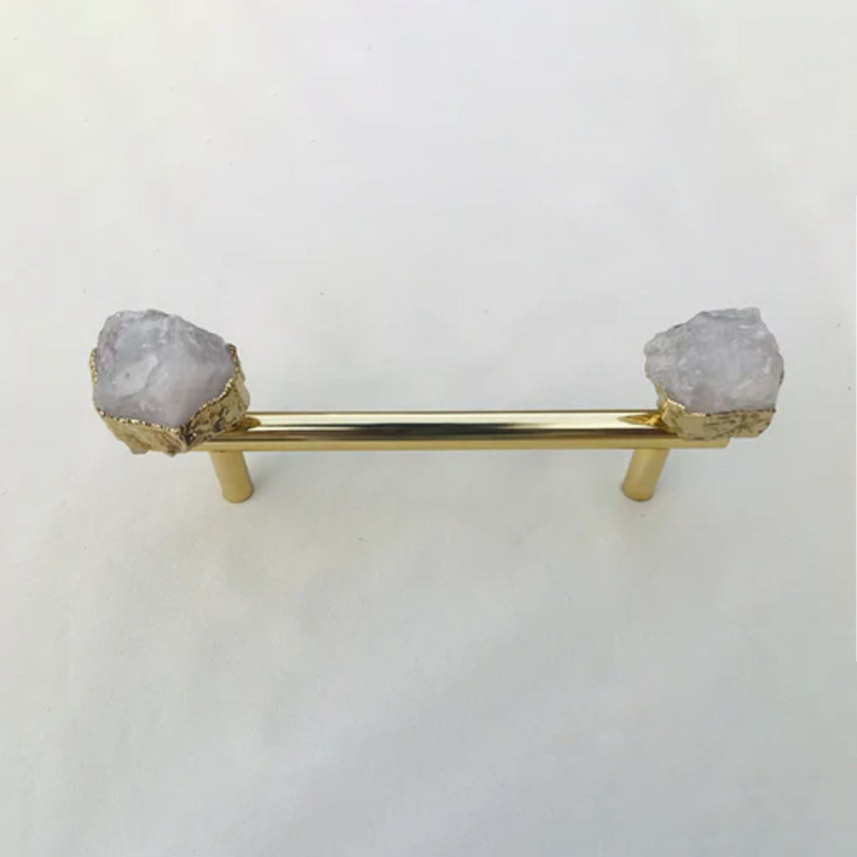 Gold rod on two posts, frosted white quartz chunks either side
