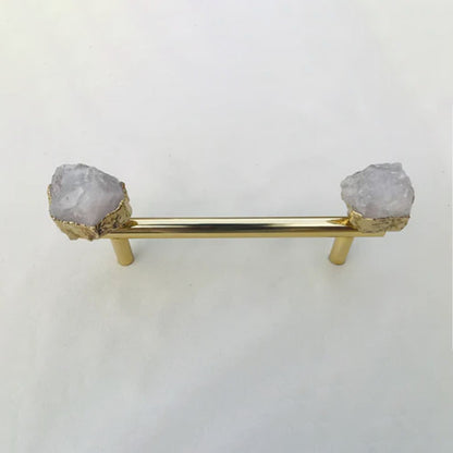 Gold rod on two posts, frosted white quartz chunks either side