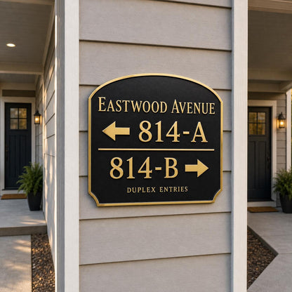 Duplex Entries plaque in antique brass, pictured on house cladding