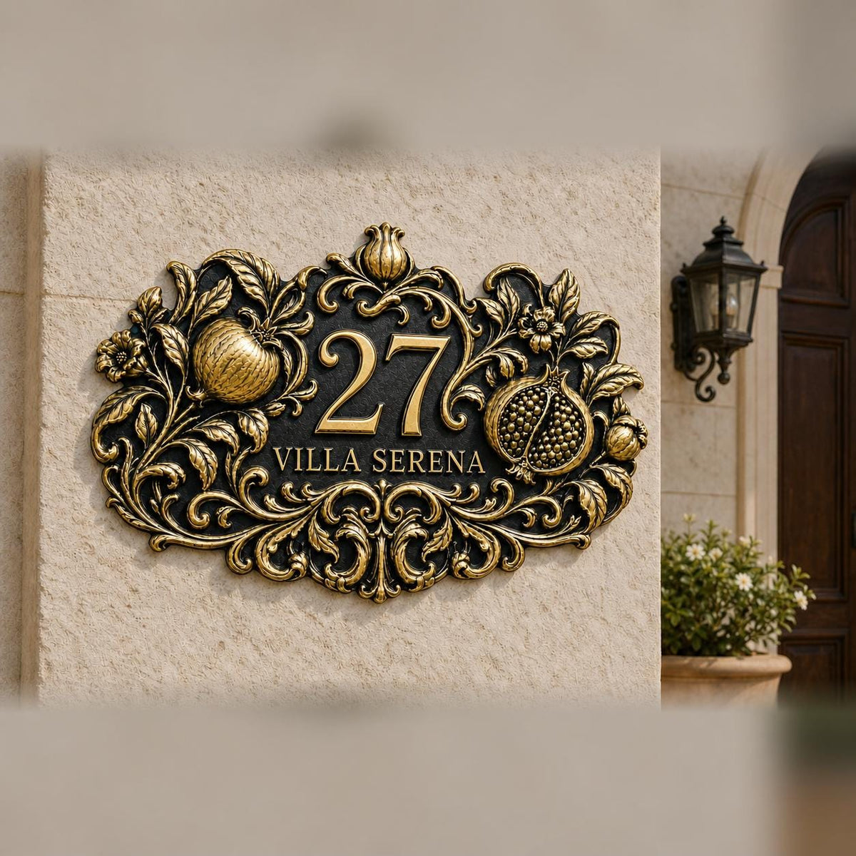 Pomegranate plaque in antique brass, pictured on a wall