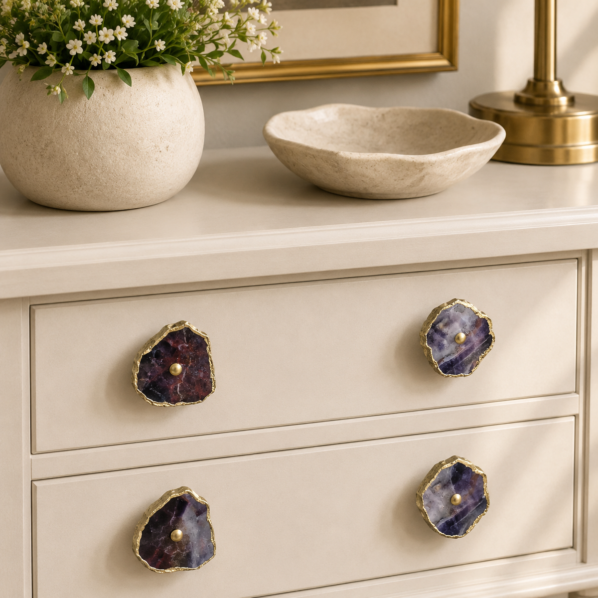 Closer view of the cream drawers, four purple amethyst slice knobs