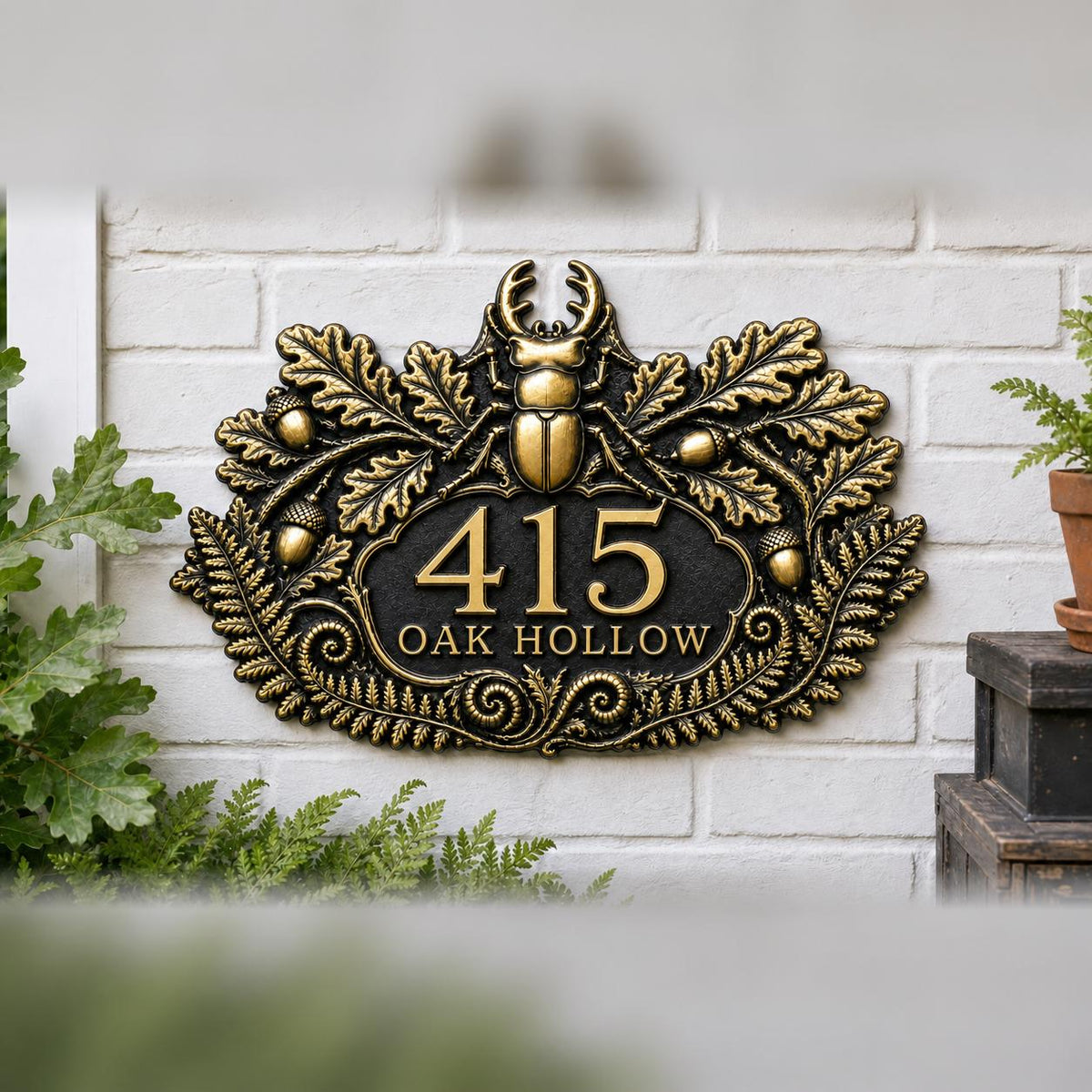 Stag Beetle and Oak plaque in antique brass, pictured on a wall