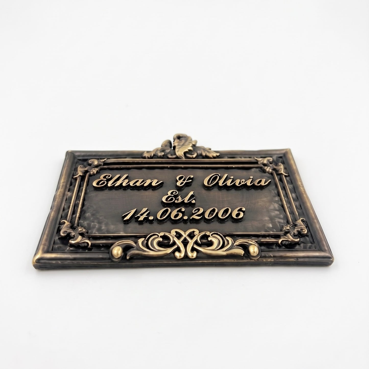 Wedding Plaque | Close-up of antique brass lettering