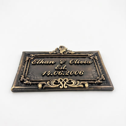Wedding Plaque | Close-up of antique brass lettering