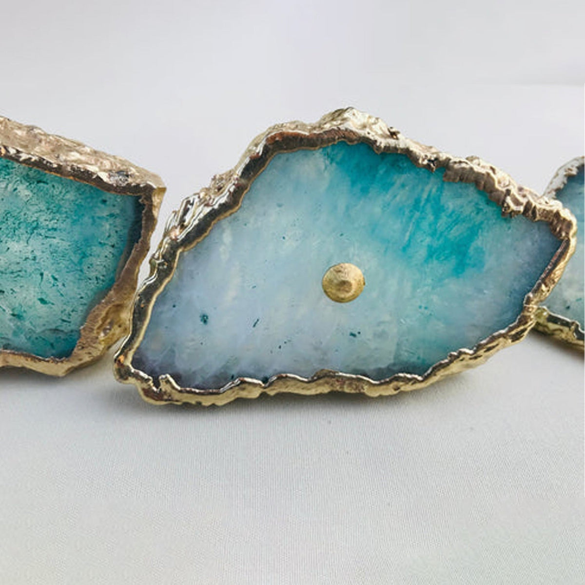 Two large slices side by side, turquoise dissolving into milky white