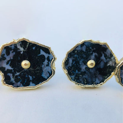 Two slices with a third at the edge, black stone patched with white
