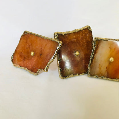 Three slices angled, honey to russet brown faces side by side
