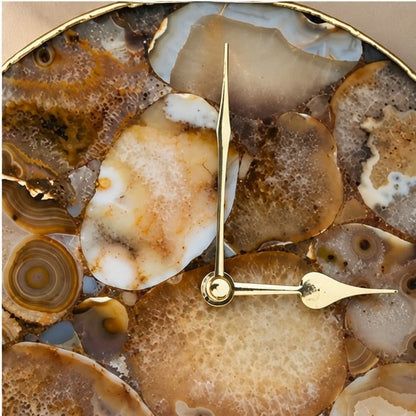 Close view of the brown and cream agate mosaic and the gold hands