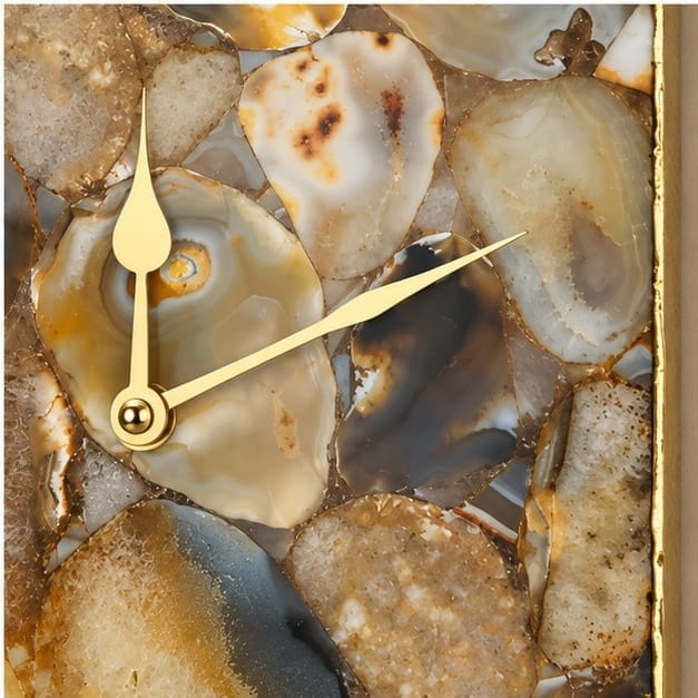 Close view of the grey and cream agate mosaic and the gold hands