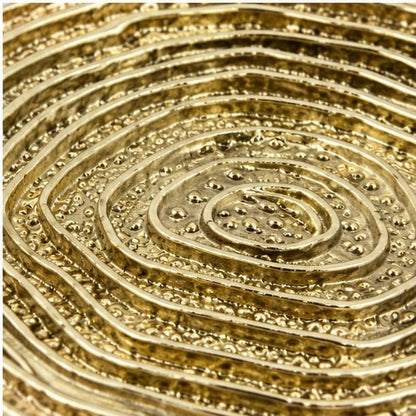 Close view of the concentric spiral ridges of the dosa tray