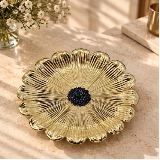 Dark centre sunflower metal tray in gold, radiating petal ridges around a navy textured centre