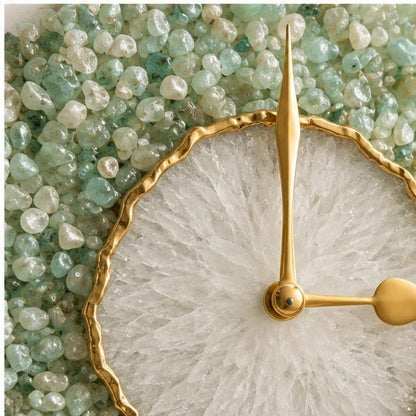 Close view of the white quartz face, gold hands and the green stone rim