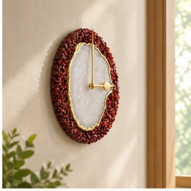 Burnt red crystal agate wall clock on a wall beside a window with greenery