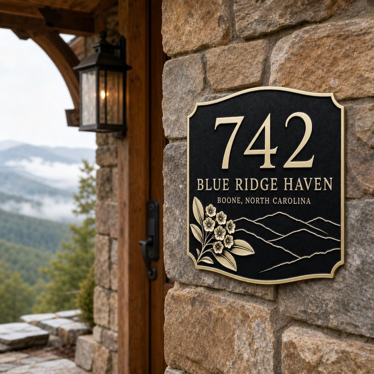 Mountain Ridge plaque pictured on a stone entrance wall with a landscape beyond