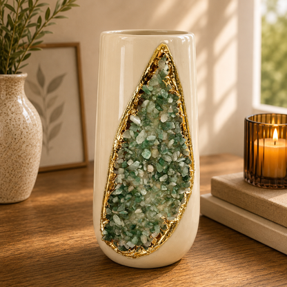 Tall cream teardrop vase with green agate inlay, styled on wood beside a lit candle