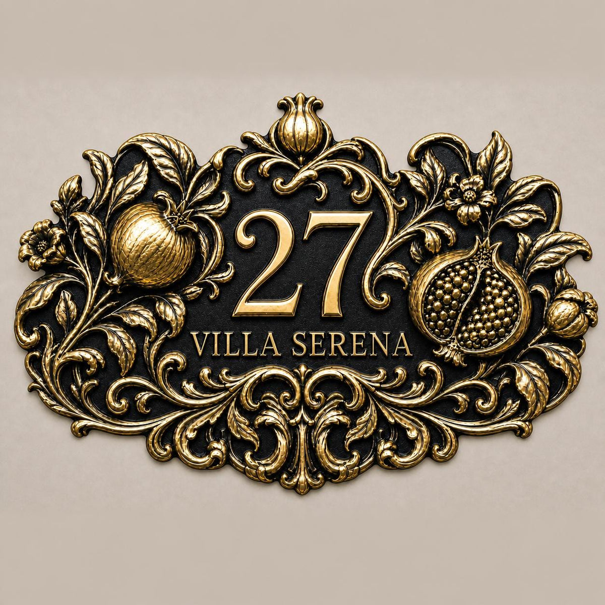Pomegranate plaque in antique brass, front view showing the raised design and lettering