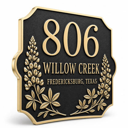 Angled Lupine plaque showing raised antique-brass lettering on a dark ground