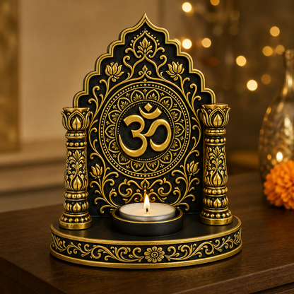Om mandir tealight holder lit on dark wood with marigolds and fairy lights behind
